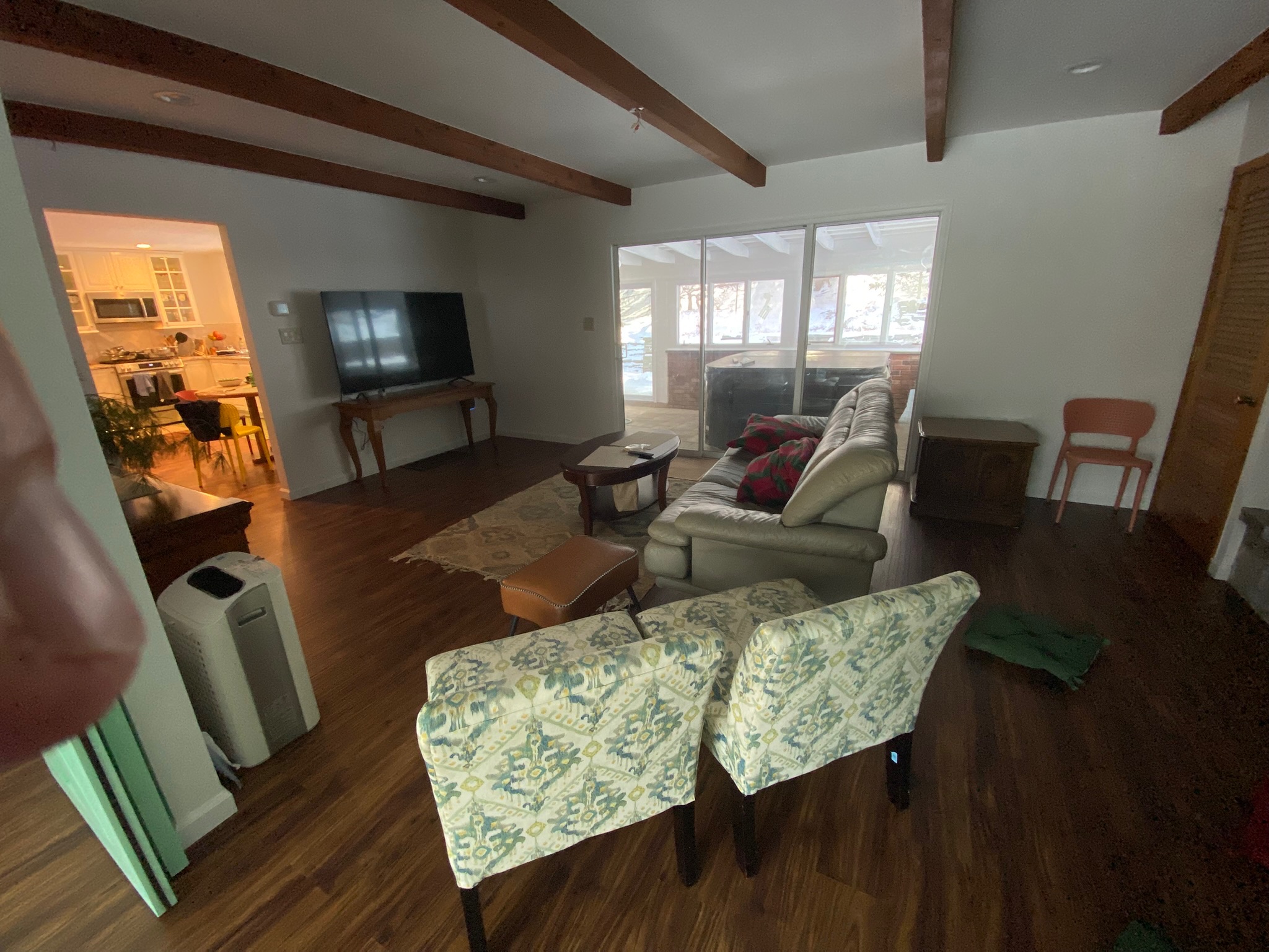 Living room looking toward the enclosed wellness patio at First Light